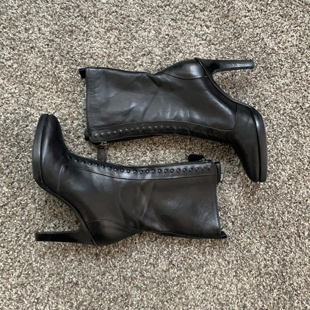Bottega Veneta black leather front zip boots.